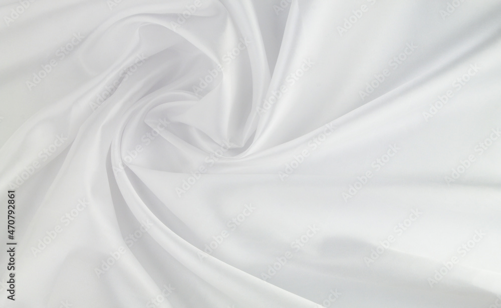 Fototapeta premium White satin or silk fabric as background. Elegant wallpaper, wedding backdrop or design element. 