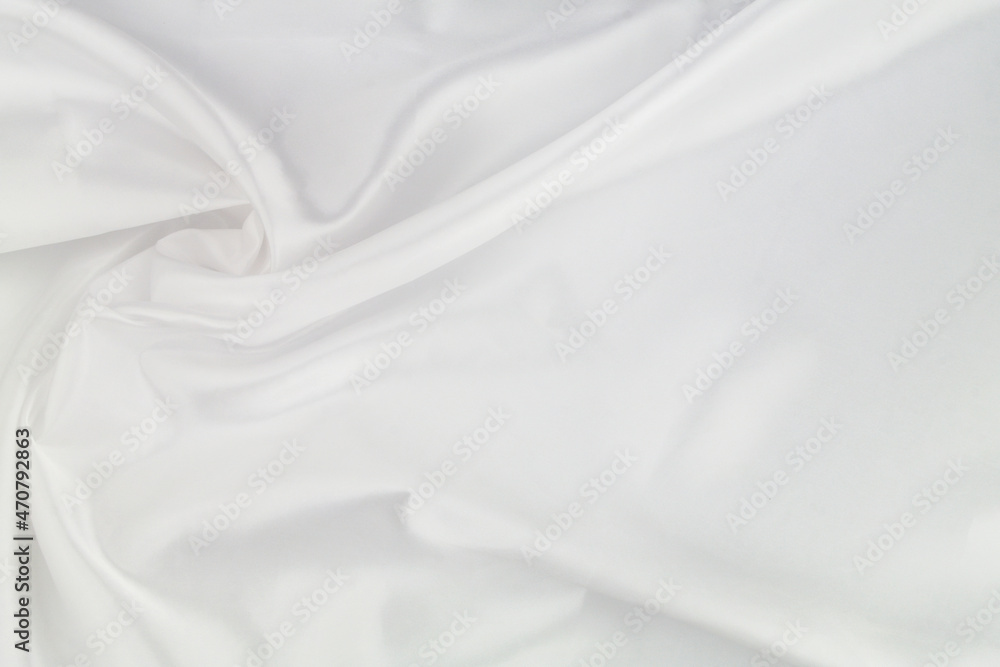 White satin or silk fabric as background. Elegant wallpaper, wedding backdrop or holidays design element. White satin or silk fabric as background. Elegant wallpaper, wedding backdrop or holidays design element.