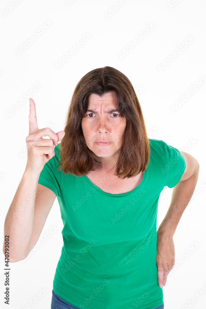 woman with finger up sad angry middle aged brunette over white background looking at camera woman with finger up sad angry middle aged brunette over white background looking at camera