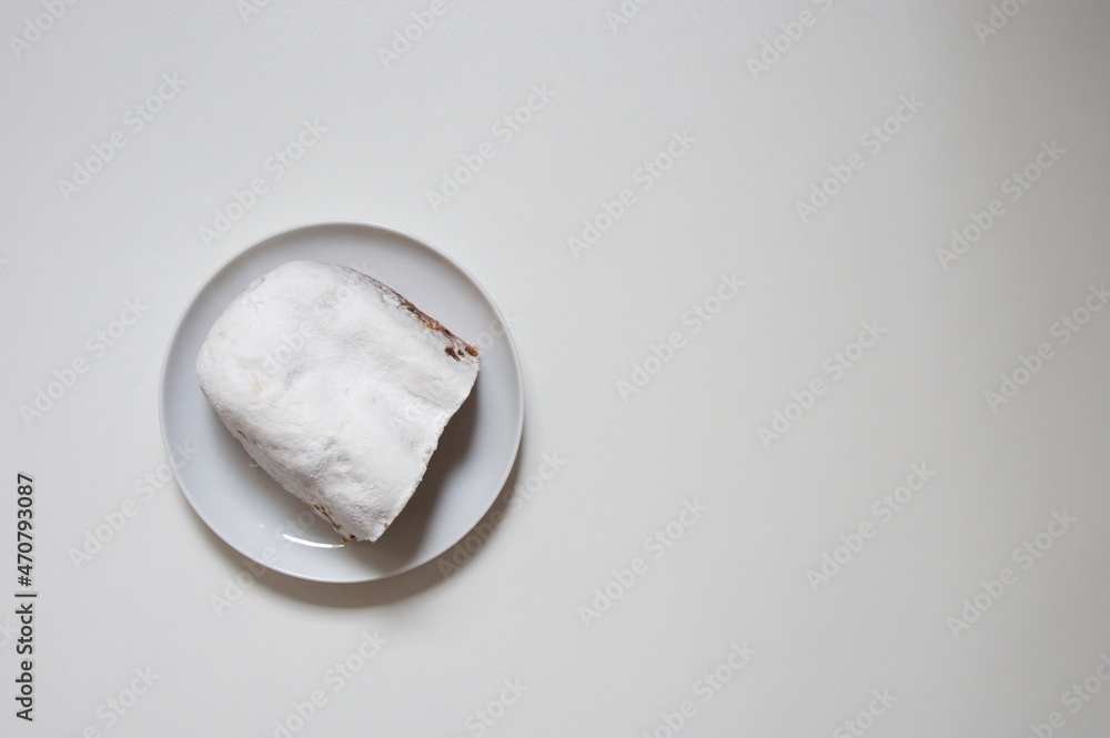Fototapeta premium Flat lay of Christmas bread on white plate against white background