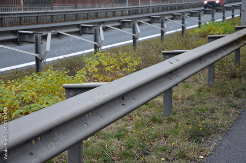 connection of metal and concrete highway barriers with screws. reinforcement with metal struts and tensioned bars in places where there is not enough space between the lanes. noise barrier