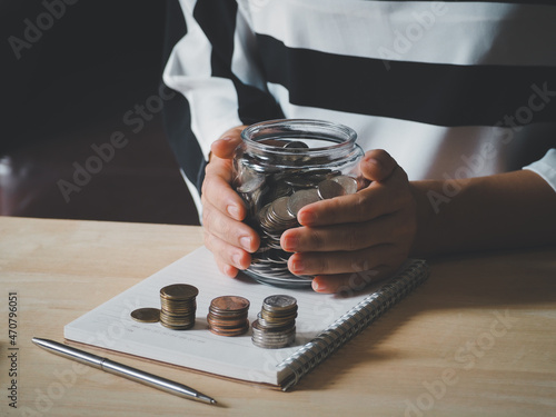 Woman holding money jar with coins close up. Investment and Saving money concept. The coin in the bottle. saving money wealth and financial concept, Business, finance, investment, Financial planning