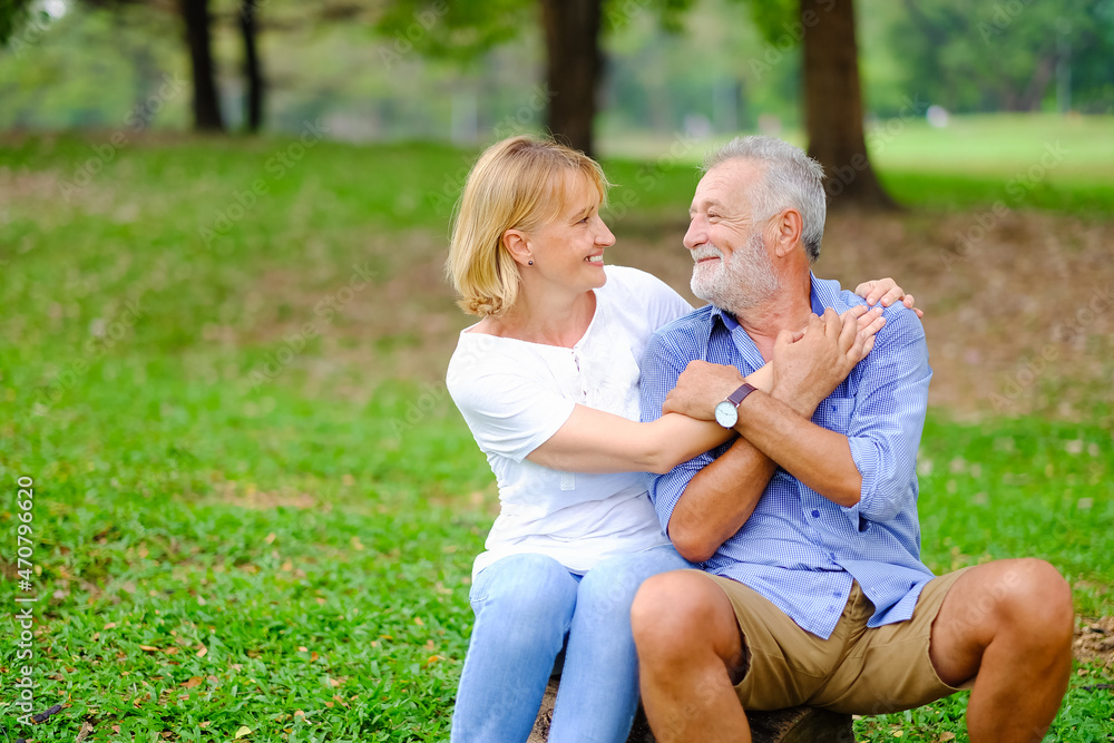 Fototapeta premium Portrait caucasian senior woman and old man, couple elder in love happy in park