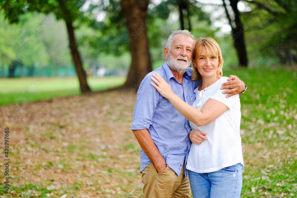 caucasian senior woman and old man, couple elder in love happy in park caucasian senior woman and old man, couple elder in love happy in park