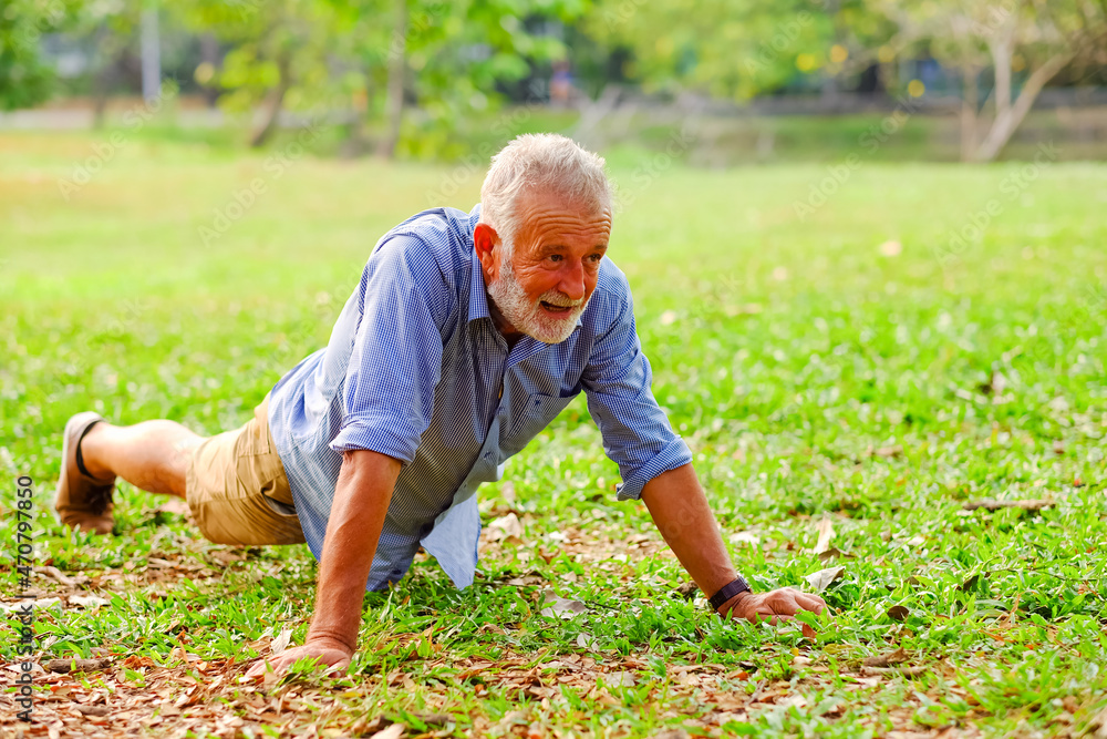 caucasian old man doing push-ups in park caucasian old man doing push-ups in park
