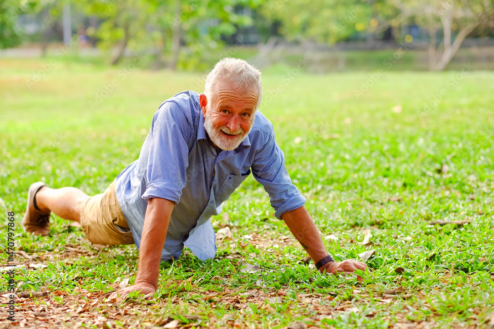 caucasian old man doing push-ups in park caucasian old man doing push-ups in park