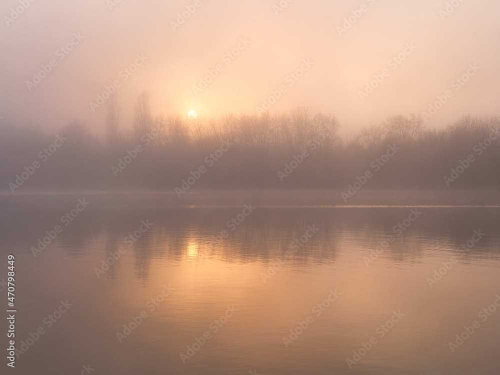 Fototapeta premium fog over the river at sunset in November
