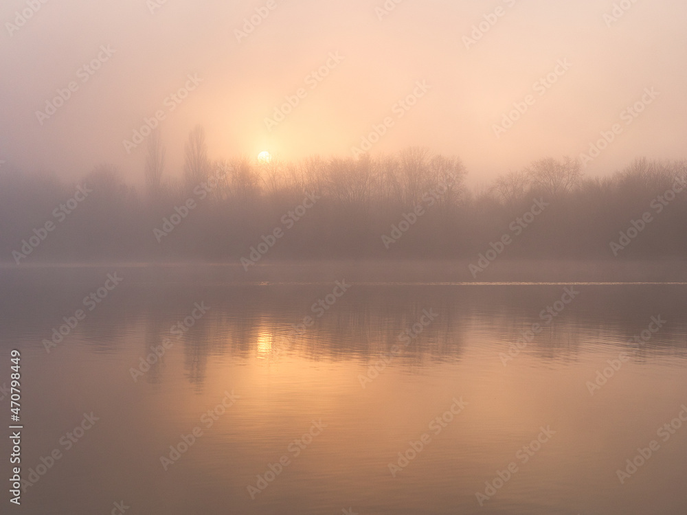 fog over the river at sunset in November