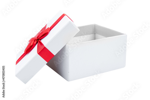 Opened white gift box with red ribbon