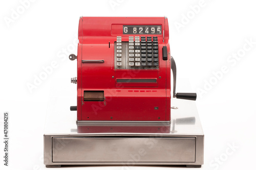 Vintage red cash register on white background