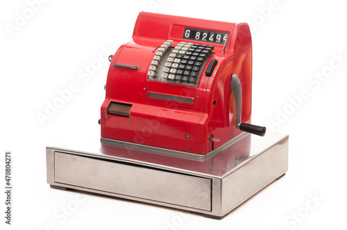 Vintage red cash register on white background