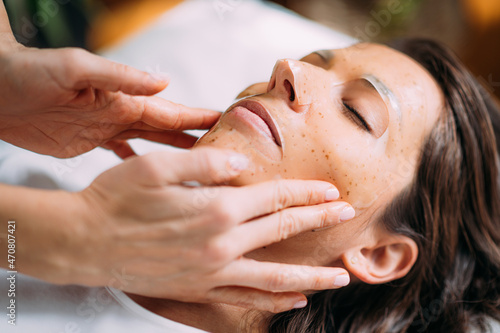 Woman with Skincare Face Mask in Beauty Salon