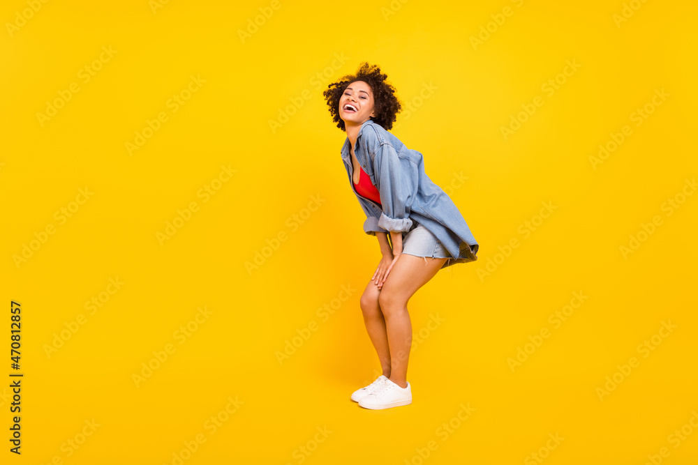 Full length photo of young happy cheerful positive dark skin woman enjoy smile isolated on yellow color background