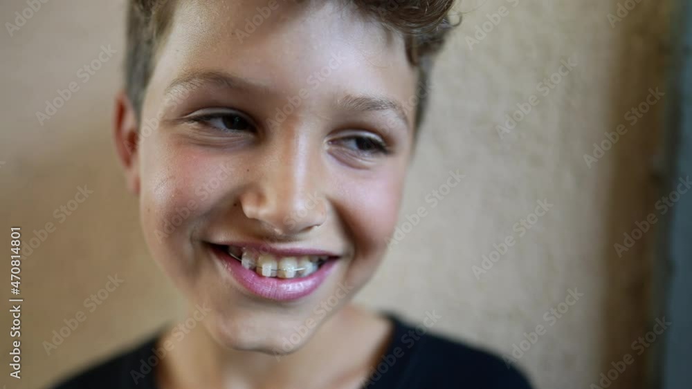 Portrait young boy child smiling at camera. Close-up kid face looking at camera Portrait young boy child smiling at camera. Close-up kid face looking at camera