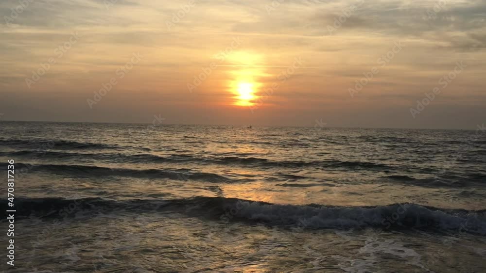 Zoom into the sea waves at sunset Zoom into the sea waves at sunset