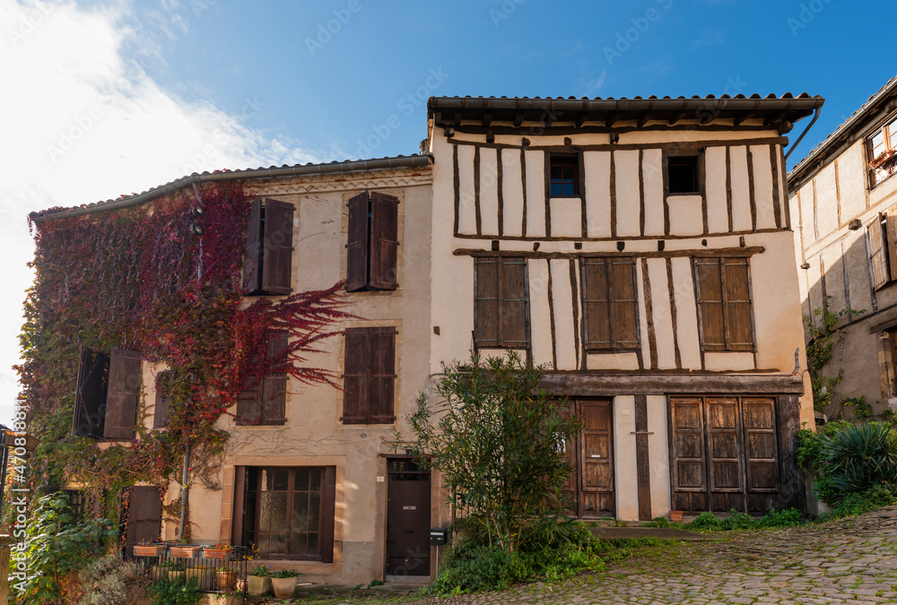 Old street and house facade in the medieval village of Cordes sur Ciel, in the Tarn, in Occitanie, France