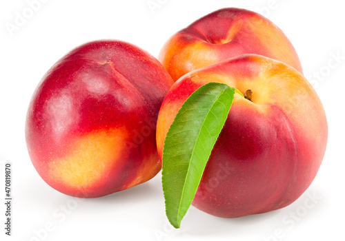 Nectarine with green leaf isolated on white background. clipping path