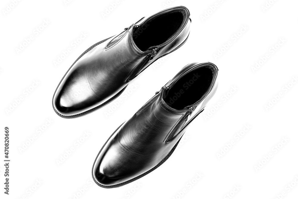 New black shoes for men with zippers isolated on a white background. Men's comfortable shoes. Top view, flat lay. New black shoes for men with zippers isolated on a white background. Men's comfortable shoes. Top view, flat lay.