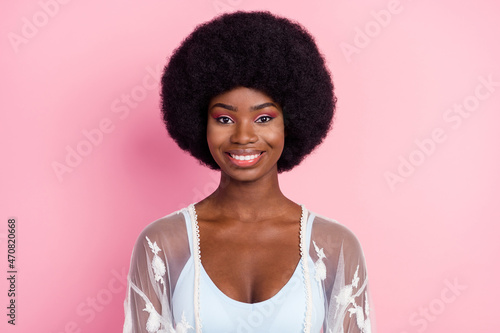 Photo portrait curly woman smiling wearing white clothes isolated pastel pink color background