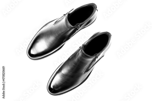 New black shoes for men with zippers isolated on a white background. Men's comfortable shoes. Top view, flat lay.