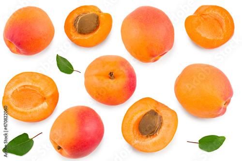apricot fruits with slices and green leaf isolated on white background. top view. clipping path