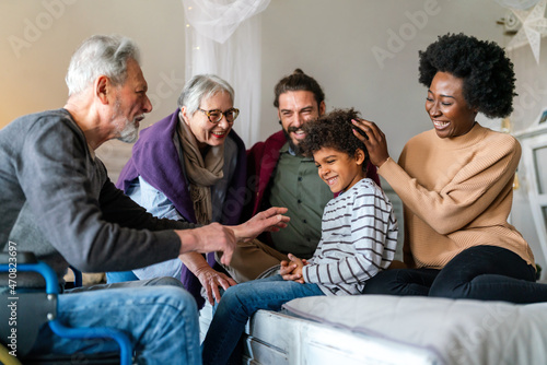 Three generation happy multiethnic family group at home