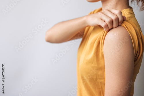 woman showing blank arm and not receiving covid 19 vaccine. Vaccination, herd immunity, side effect, anti vaccine and Coronavirus pandemic
