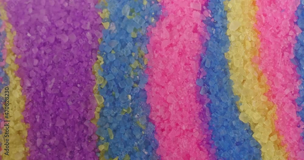 Macro crystals of colored sand. The texture of the grains of sand close-up. Macro crystals of colored sand. The texture of the grains of sand close-up.