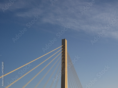 Fototapeta Naklejka Na Ścianę i Meble -  多摩川に掛かる橋の支柱。夕陽に照らされる府中四谷橋。