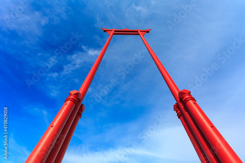 Photography The giant swing on the background of the sky and clouds