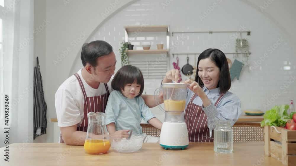Asian family with father Mother and son helping to cook Making a smoothie in the kitchen
Asian family with father Mother and son helping to cook Making a smoothie in the kitchen