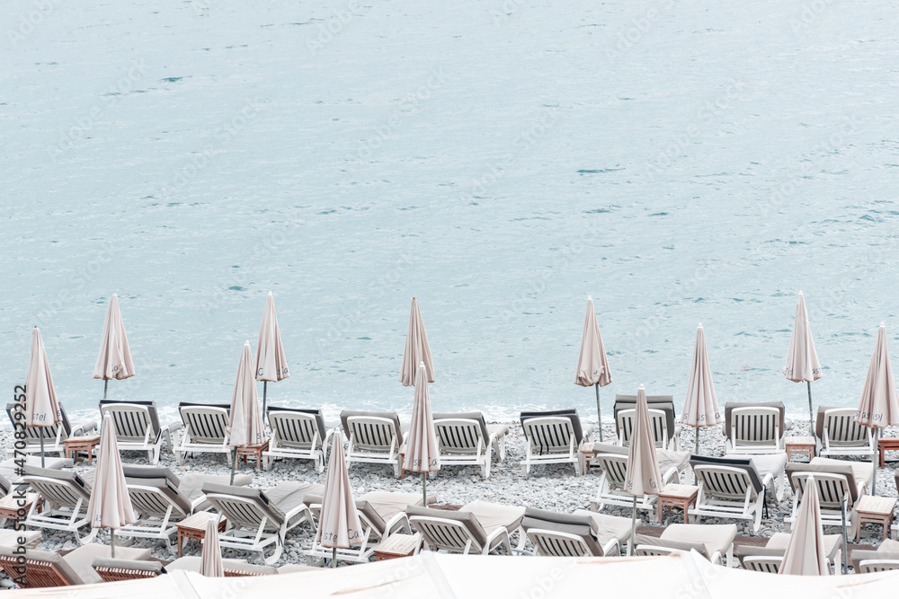 beach chairs and umbrellas at promenade des anglais