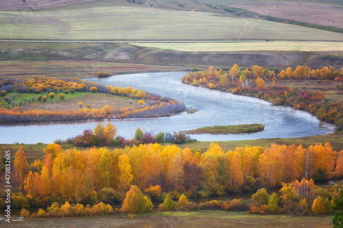 Cloudy autumn landscape with river