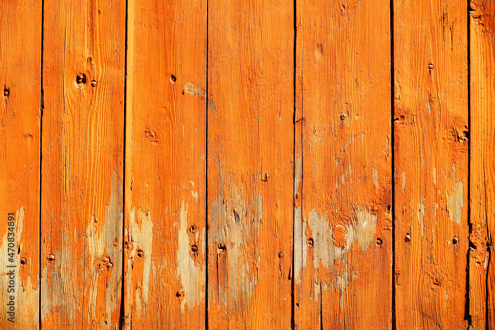 Wooden ocher background. Old barn wall with peeling paint Wooden ocher background. Old barn wall with peeling paint