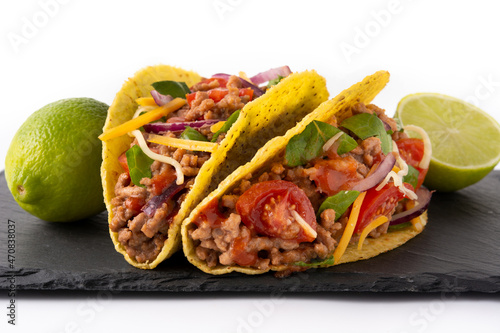 Traditional Mexican tacos with meat and vegetables isolated on white background	