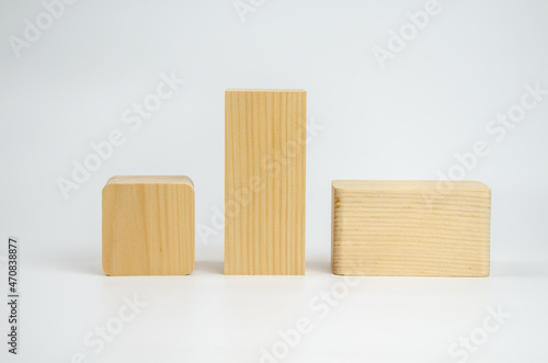Wooden cubes from different tree species with different edge treatments. several wooden building blocks on a white background. Eco-friendly materials for construction, decoration and repair.