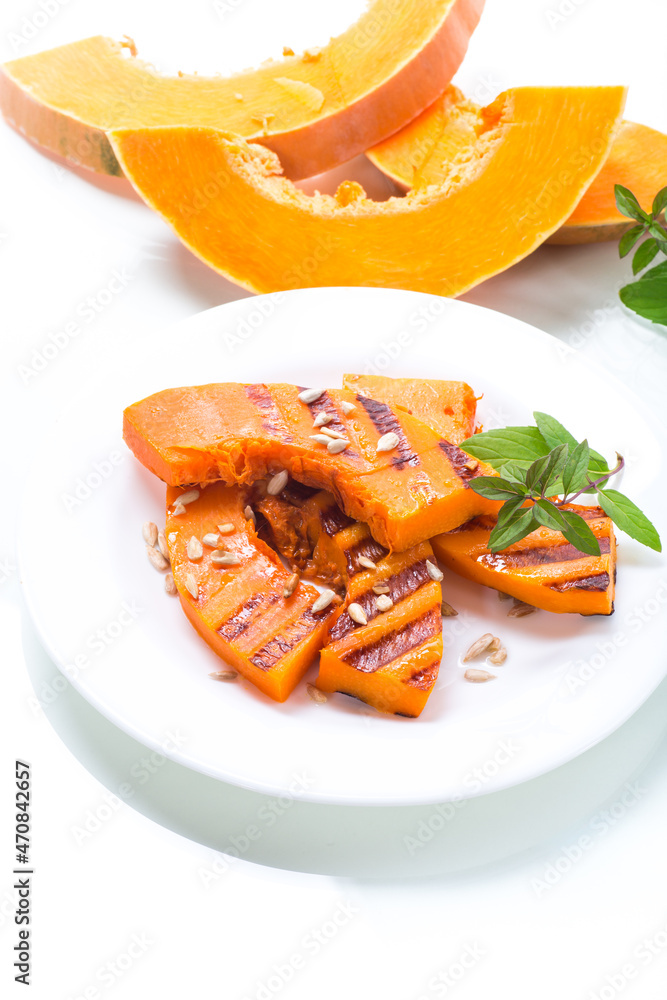 sweet baked grilled pumpkin with seeds in a plate sweet baked grilled pumpkin with seeds in a plate