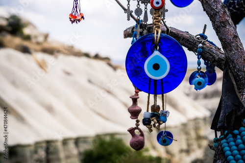 Close up view of evil eye amulet on mountain background in Cappadocia, Turkey