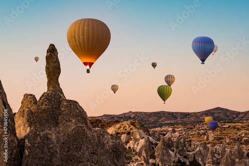 Hot air balloons flying in Cappadocia sky, Turkey