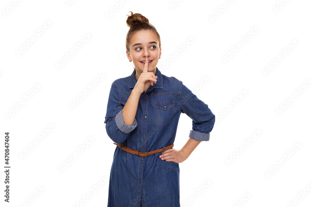 Photo of a beautiful cute smiling girl with dark hair and a bun in a brown hoodie with a hood isolated on a white background with a place for text Photo of a beautiful cute smiling girl with dark hair and a bun in a brown hoodie with a hood isolated on a white background with a place for text
