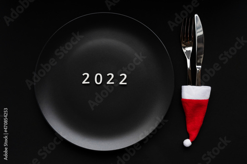 Numbers 2022 on a plate  conceptual photo. New Year s table decoration.