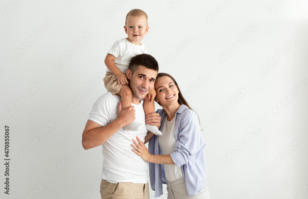 Portrait Of Happy Young Mother, Father And Their Cute Toddler Son Portrait Of Happy Young Mother, Father And Their Cute Toddler Son