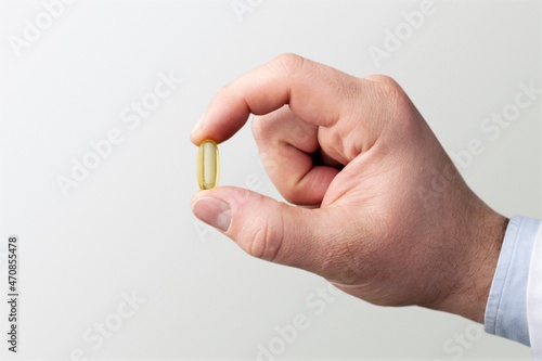 Male doctor with holding medicine pill. Medical covid-19 concept.