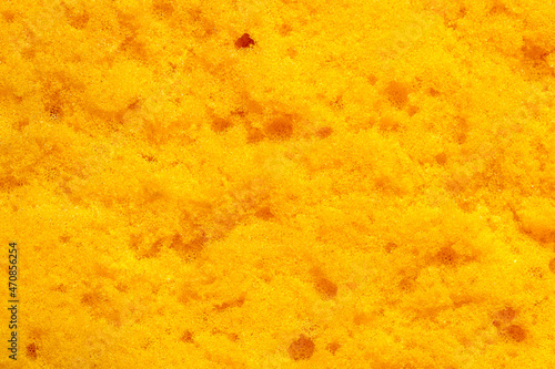 close-up image of old yellow sponge