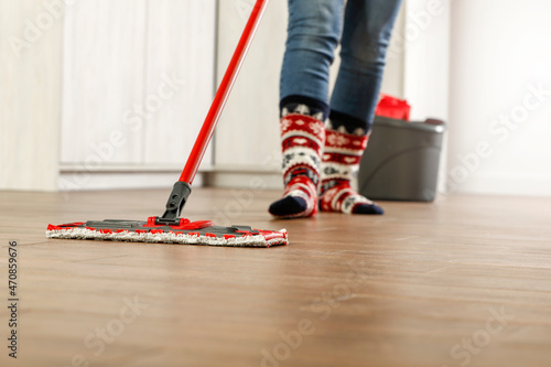 Christmas cleaning in socks, the floor with a free space 