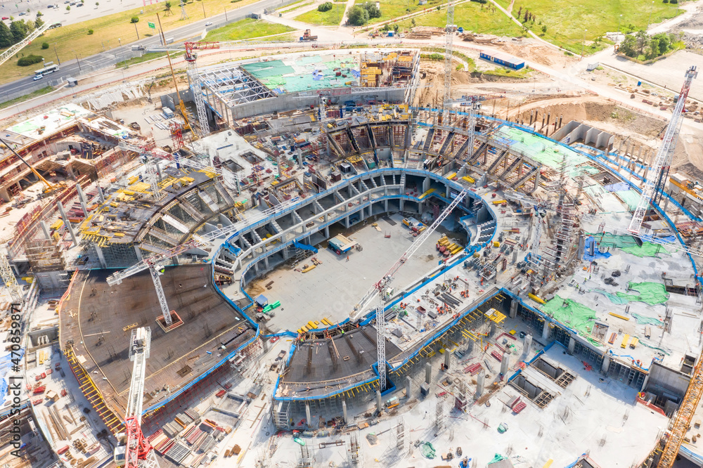 Large-scale construction of a stadium aerial view.