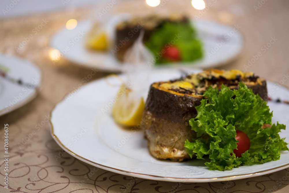 Baked fish stuffed with melted cheese and lemon Baked fish stuffed with melted cheese and lemon
