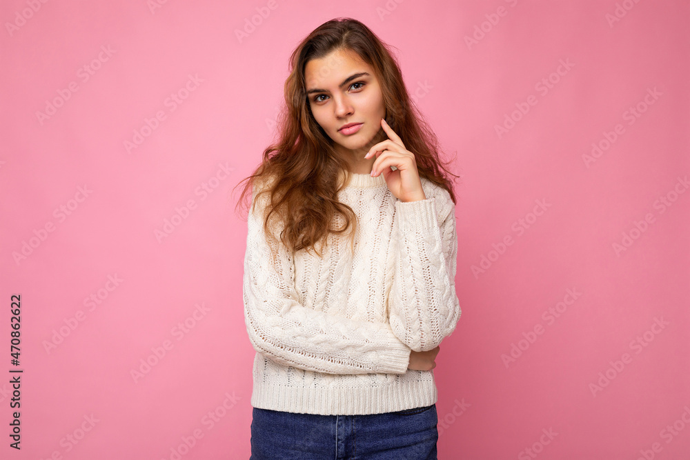 Portrait of young attractive caucasian hipster woman in trendy casual clothes. Sexy carefree female person posing isolated near pink wall in studio. Positive self-confident serious model with natural Portrait of young attractive caucasian hipster woman in trendy casual clothes. Sexy carefree female person posing isolated near pink wall in studio. Positive self-confident serious model with natural