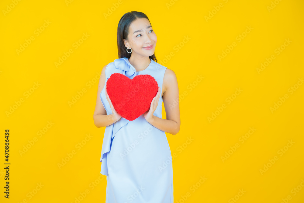 Portrait beautiful young asian woman smile with heart pillow shape Portrait beautiful young asian woman smile with heart pillow shape