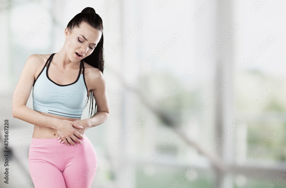 Flatulence young woman, girl hand in stomach ache, suffer from food poisoning, abdominal pain Flatulence young woman, girl hand in stomach ache, suffer from food poisoning, abdominal pain